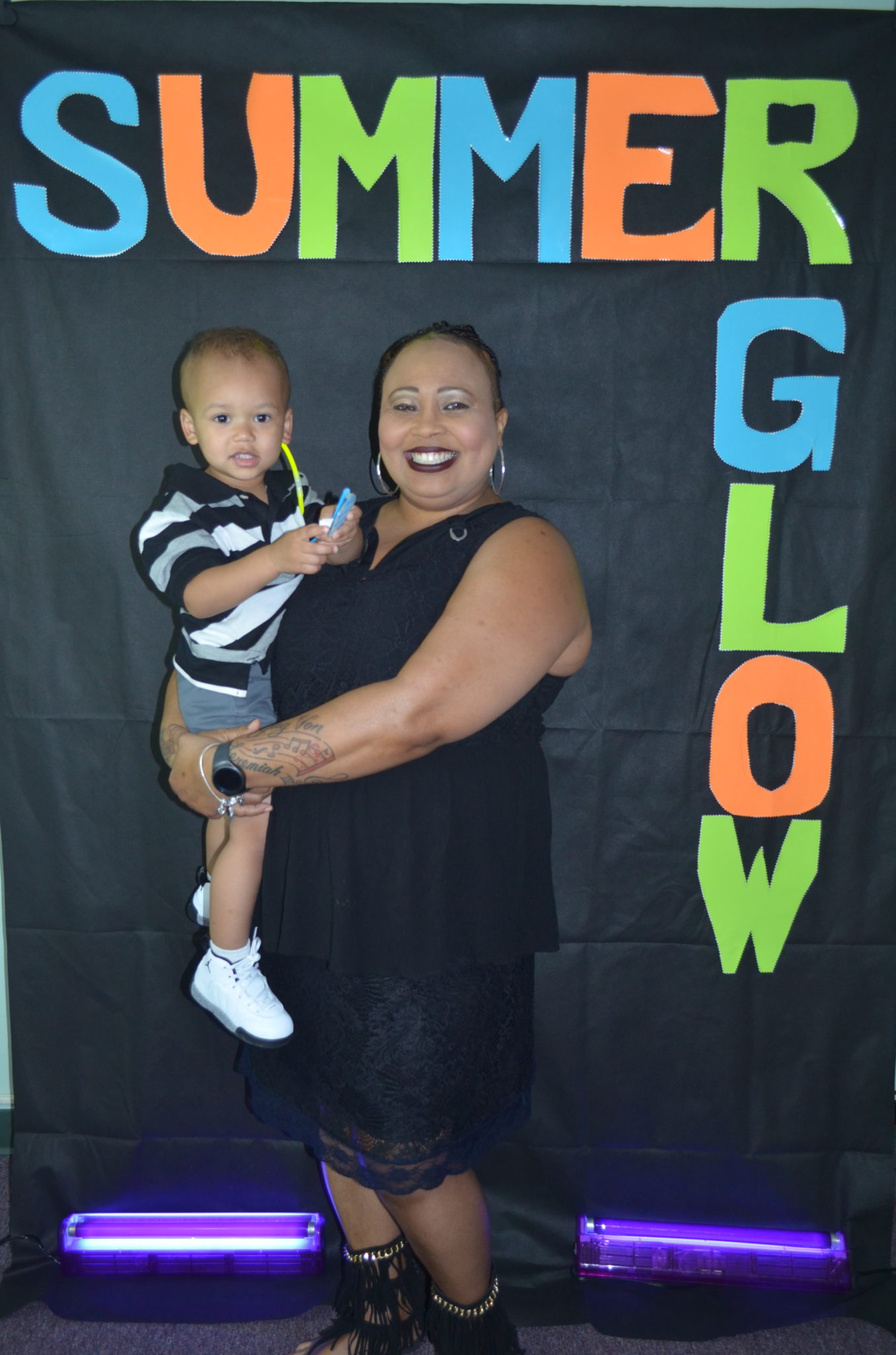 family posing for photo in front of Summer Glow Background