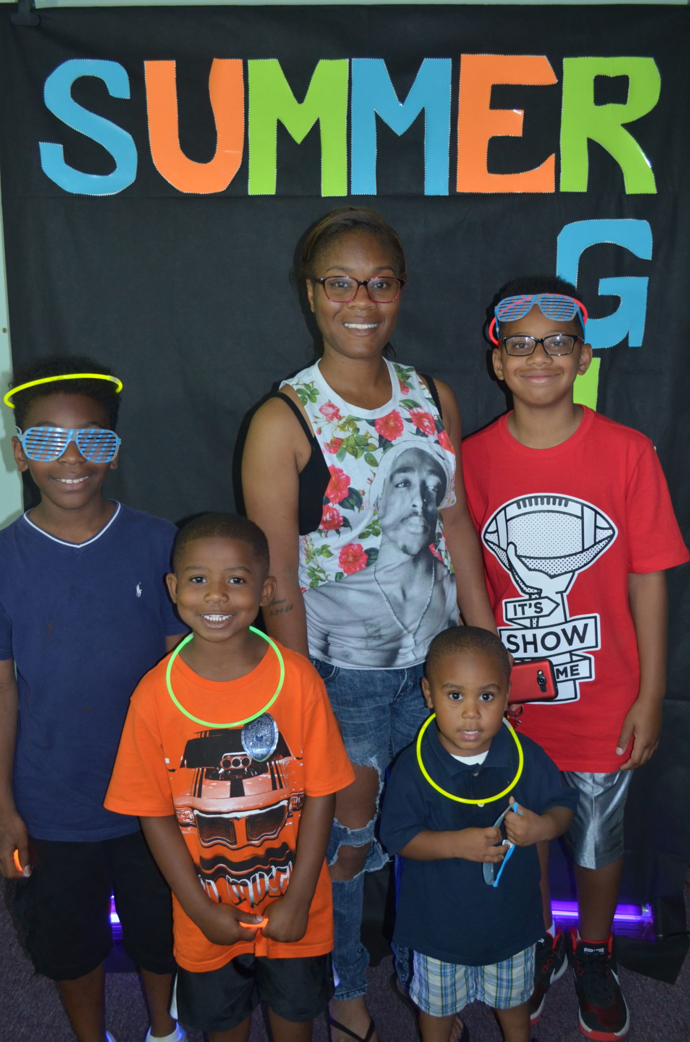 family posing for photo in front of Summer Glow Background