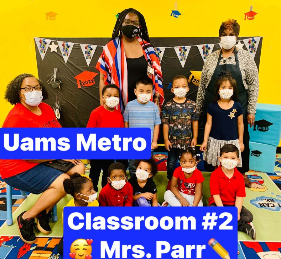 Children and staff pose for a photo with a caption saying UAMS Metro, Classroom # 2 Mrs. Parr